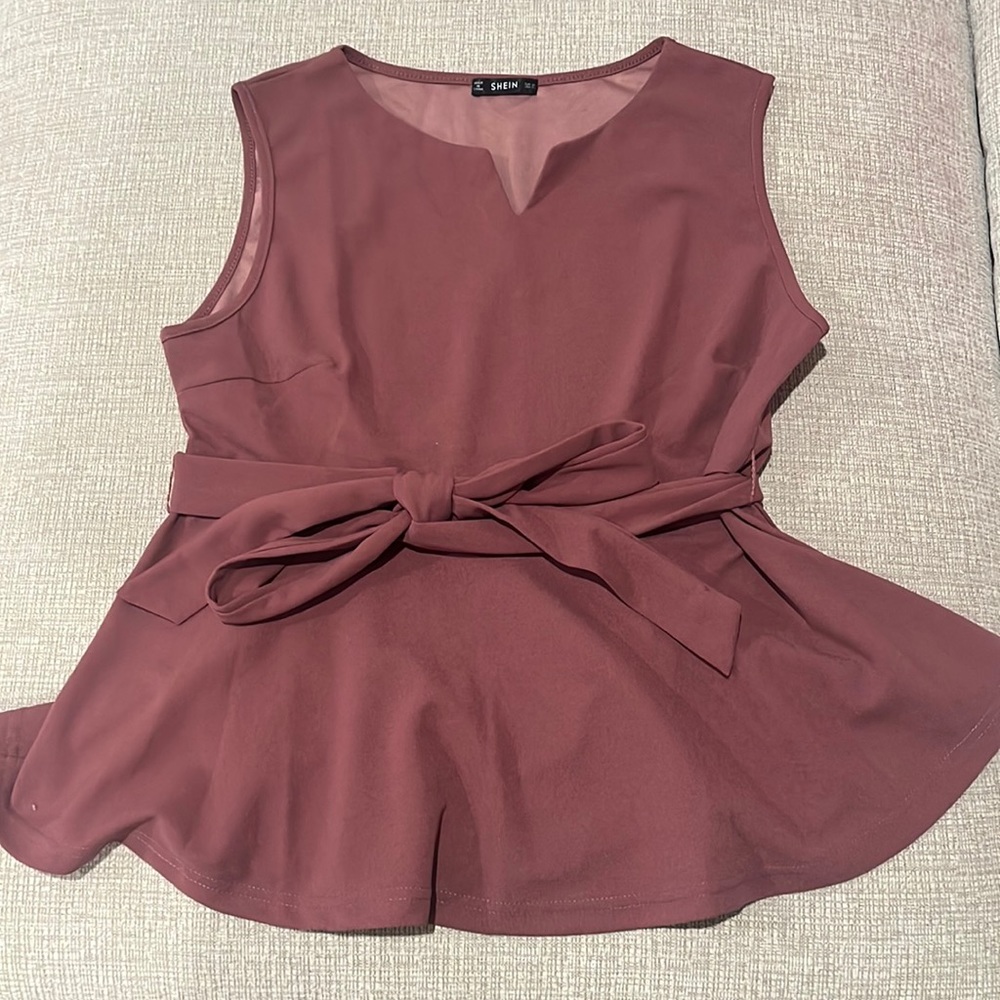 Brand new plum colored peplum top with detachable belt